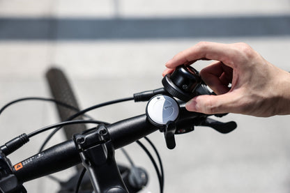 MiBell, a discreet smart bike bell with a hidden tracker, compatible with Apple Find My and Google Find Hub network for anti-theft bicycle security.